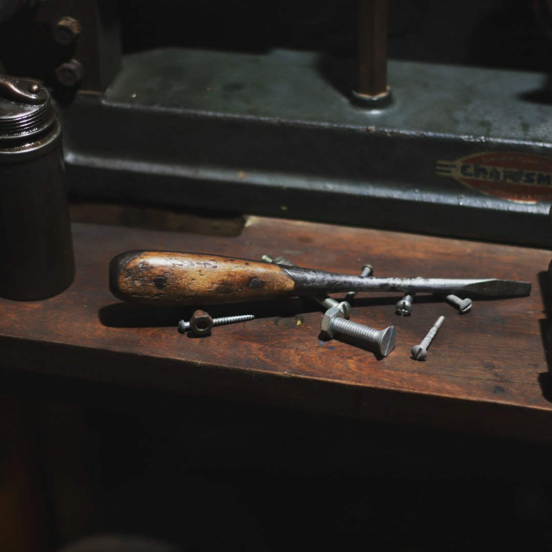 a wooden table topped with lots of tools